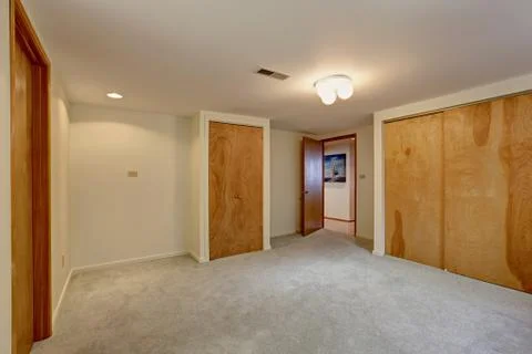 Empty basement room with closet Stock Photos