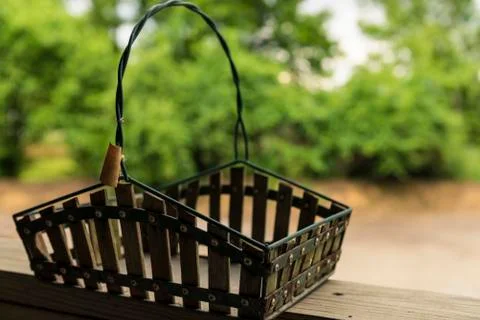 Empty basket sitting on railing Stock Photos