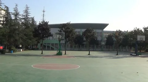 Empty basketball playground in a high school Stock Footage 45019423