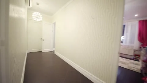 Empty bathroom, moving into hallway, room with sofa Stock Footage 276364405