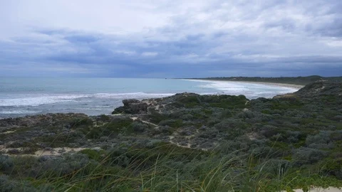 Empty bay with cold waves on an ocean beach in winter Stock Footage 94465437