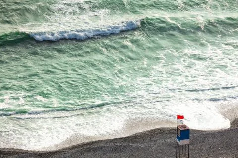 Empty beach with an abandoned observation tower. Stock-Fotos