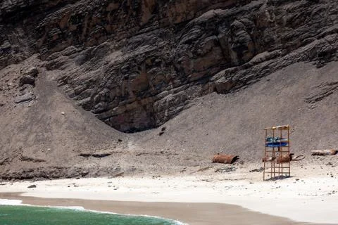 Empty beach with an abandoned observation tower. Stock-Fotos