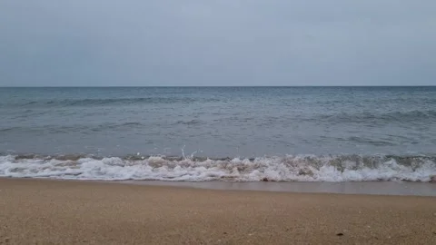 Empty Beach After Rain, Calm Water and Misty Horizon Stock Footage 318740862