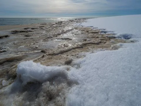 Empty beach after snowfall Stock Photos