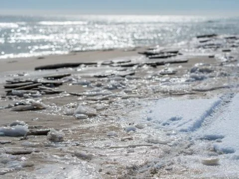 Empty beach after snowfall Stock Photos