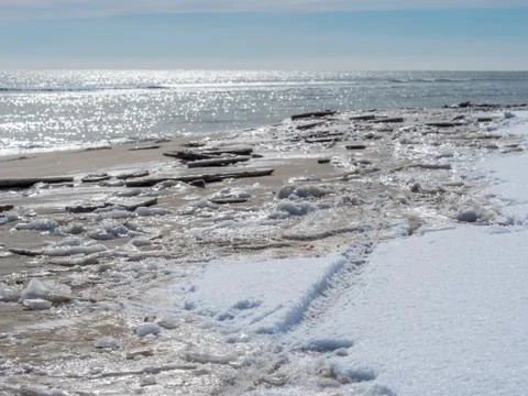 Empty beach after snowfall Stock Photos