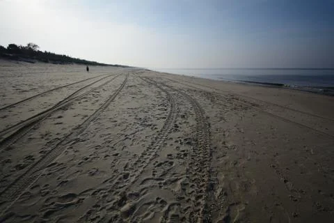 Empty beach in the afternoon sunlight Stock Photos