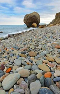 Empty beach against mountains Stock Photos