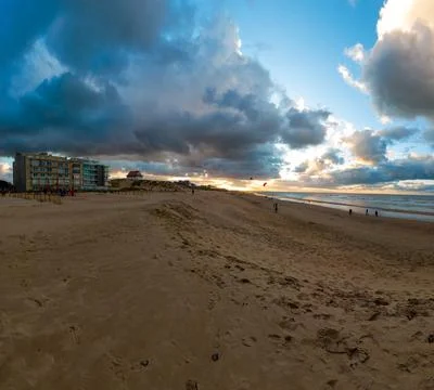 Empty beach in autumn at sunset Stock Photos