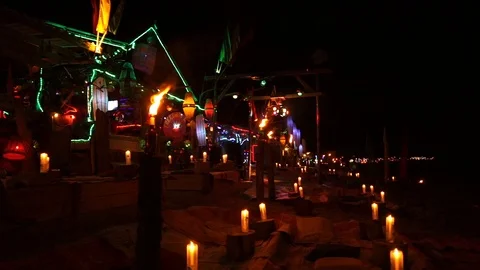 Empty beach bar at night with spotlights torches Stock Footage 111470731