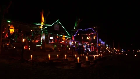 Empty beach bar at night with spotlights torches Stock Footage 111470790