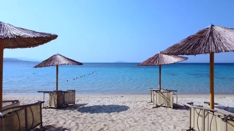 Empty beach bar on sand beach with wooden umbrellas. Aerial view 動画素材 138960130