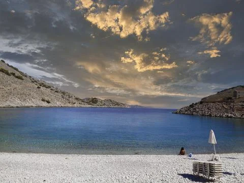 Empty beach in a bay in summer Stock Photos