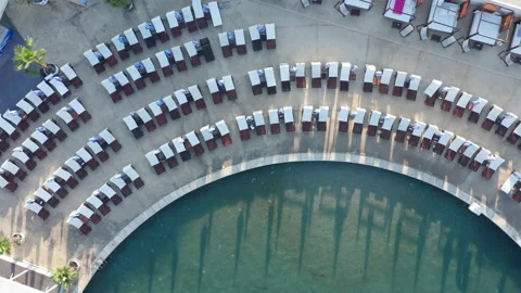 Empty beach beds on the concrete beach - pier or dock lining a small marina Stock Footage 213655643