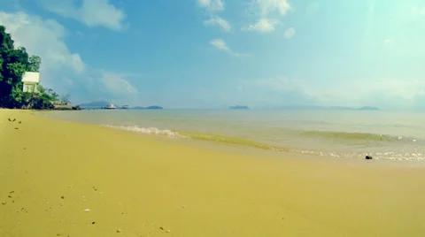 Empty beach with buddhist temple on pier in background Stock Footage 36805290