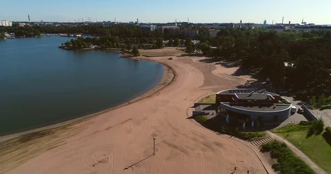 Empty beach, C4k aerial view backwards of Hietaranta city beach, on a sunny s Stock Footage 91286668
