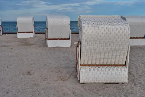 Empty beach cabins on a deserted beach. 库存照片