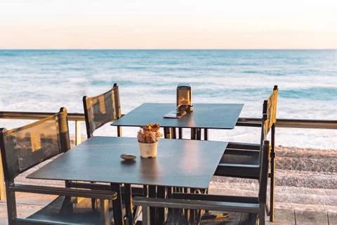 Empty beach cafe without visitor, people. Empty Beach chair, table, bay, seas Stock Photos