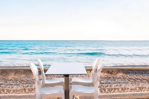 Empty beach cafe without visitor, people. Empty Beach chair, table, bay, seas Stock Photos