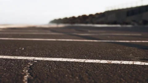 Empty beach car park spaces covered in asphalt. Stock Footage 233526824