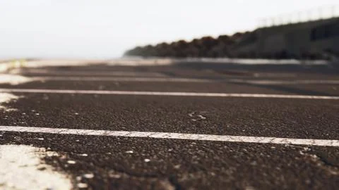Empty beach car park spaces covered in asphalt. Stock Illustration