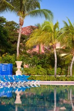 Empty beach chairs near  pool Stock Photos