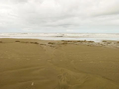 Empty beach with cloudy sky Stock Photos