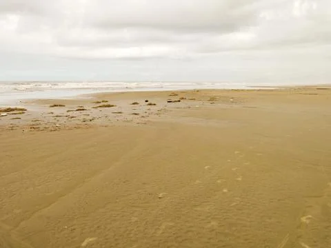Empty beach with cloudy sky Stock Photos