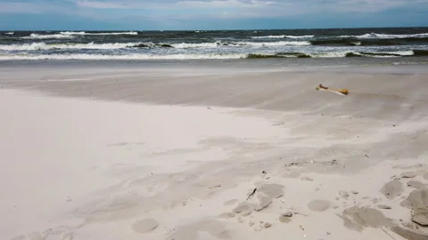 Empty beach on a cloudy, windy day and fast-moving sand - the Baltic Sea Stock Footage 152159888