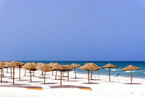 Empty Beach Covered with Umbrellas in Sousse, Tunisia. Stock Photos