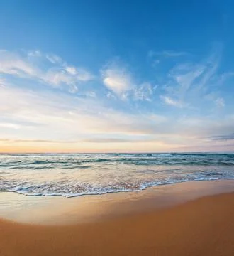An empty beach at dawn or dusk Stock Photos