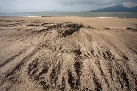 Empty beach with different pattern on sand Stock Photos