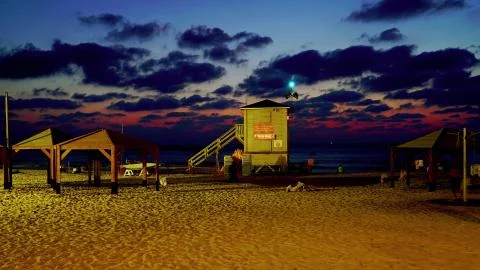 Empty beach in the evening at beautiful sunset Stock Photos