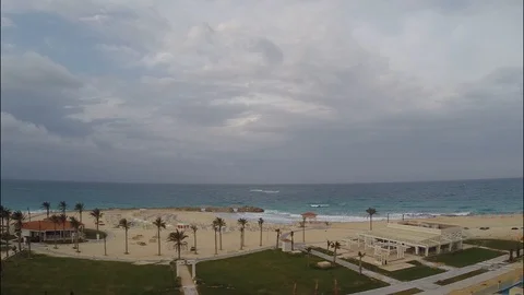 Empty beach in front. the copter flies on empty sun beds and clean sand Stock Footage 126732604