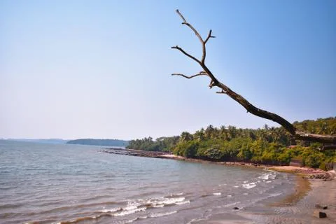 A empty beach in goa with small waves Stock Photos