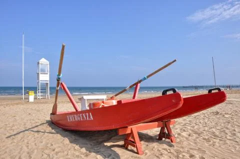 Empty beach with guard tower and rescue boat in Rimini Stock Photos