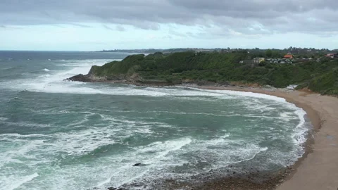 Empty beach Lafitenia Basque coastline aerial shot cloudy day France Stock Footage 224501000