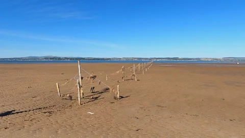 Empty Beach at Low Tide Near Tentsmuir, Scotland, Fence Leading into Distance 스톡 동영상 328437187