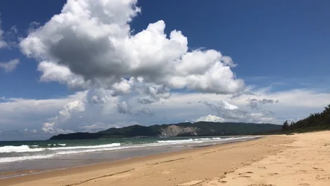 Empty beach with mountains seaside in China on Hainan Island Chinese Hawaii Stock Footage 128534452