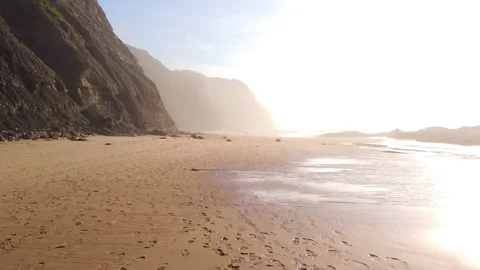 Empty beach of Portuguese coast with waves breaking on shore. Stock Footage 143732885