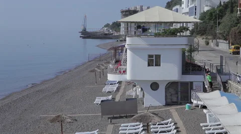 Empty beach rescue tower deck chairs Stock Footage 53497849