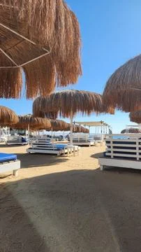 Empty beach resort with straw umbrellas 스톡 사진