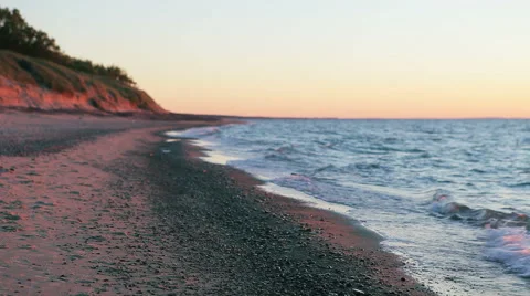Empty Beach of Sand and Pebbles at Sunset Stock Footage 61496002
