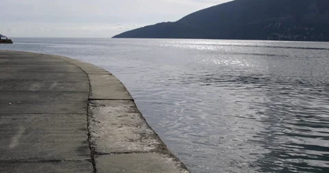 Empty beach at seaside at early autumn, Boka bay, Adriatic sea, Montenegro, Medi Stock Footage 322185710