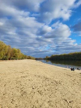 Empty beach shore under blue sky Stock Photos