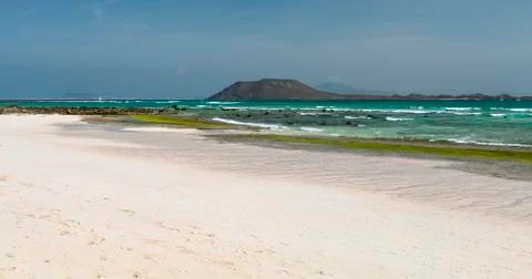 Empty beach with some rocks near Corralejo in Fuerteventura, Spain, the Isla  Stock Photos
