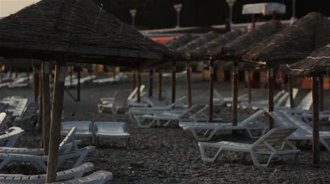 Empty Beach with Sunbeds at Sunset Stock Footage 62741107