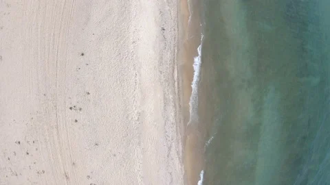 Empty beach. Top down, aerial view. Drone flies back Stock Footage 106202654
