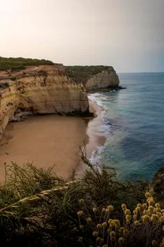 Empty beach viewed from the top of a cliff Stock Photos